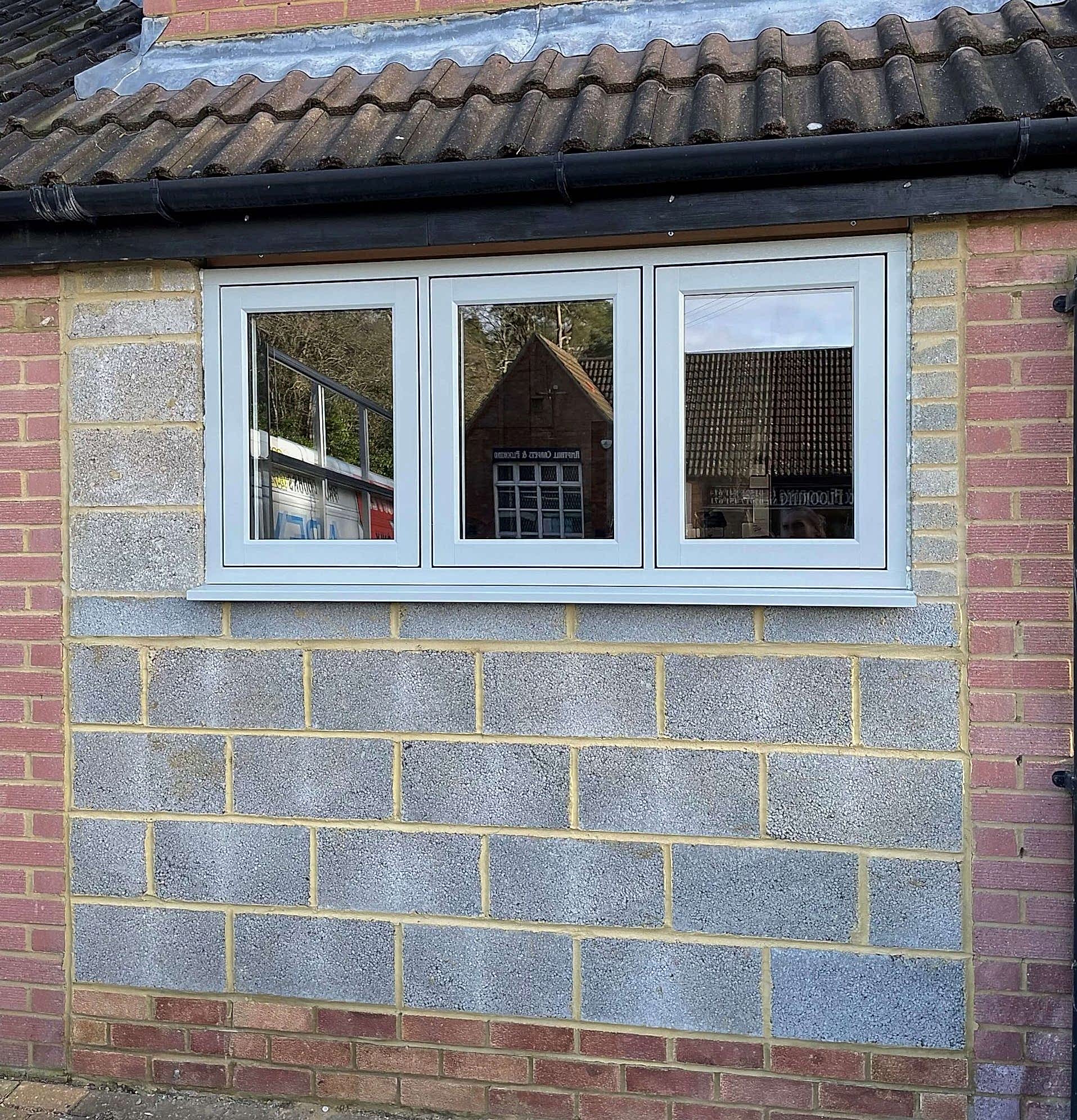 Modern office with large windows, sleek furnishings, vibrant vibe